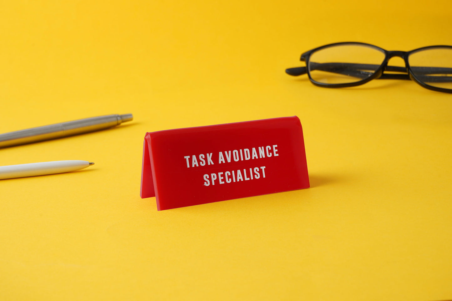 Red Acrylic Desk Sign | 'Task Avoidance Specialist' | Office | Desk Sign