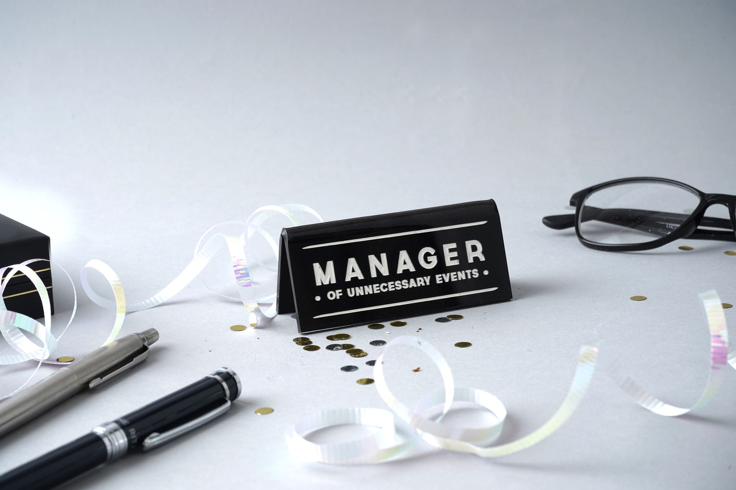 Black Desk Sign 'Manager Of Unnecessary Events'