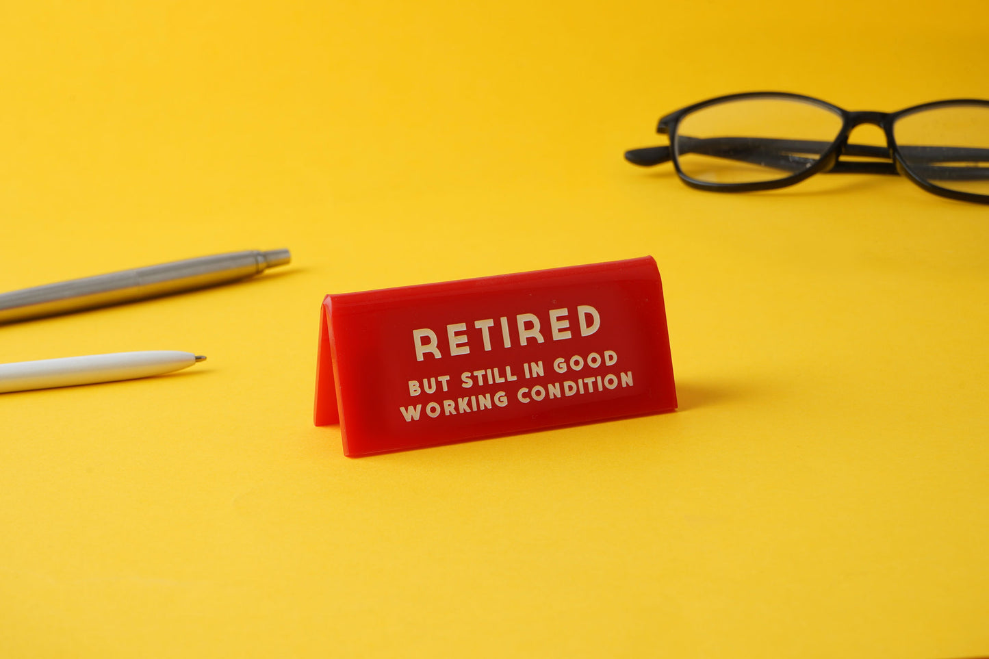 It's A Sign 'Retired But Still...' Red Desk Sign