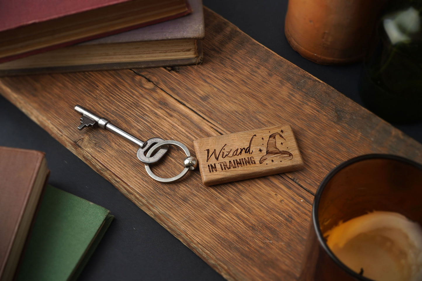 Personalised Rectangular Oak Keyring 'Wizard In Training' With Witch's Hat Illustration