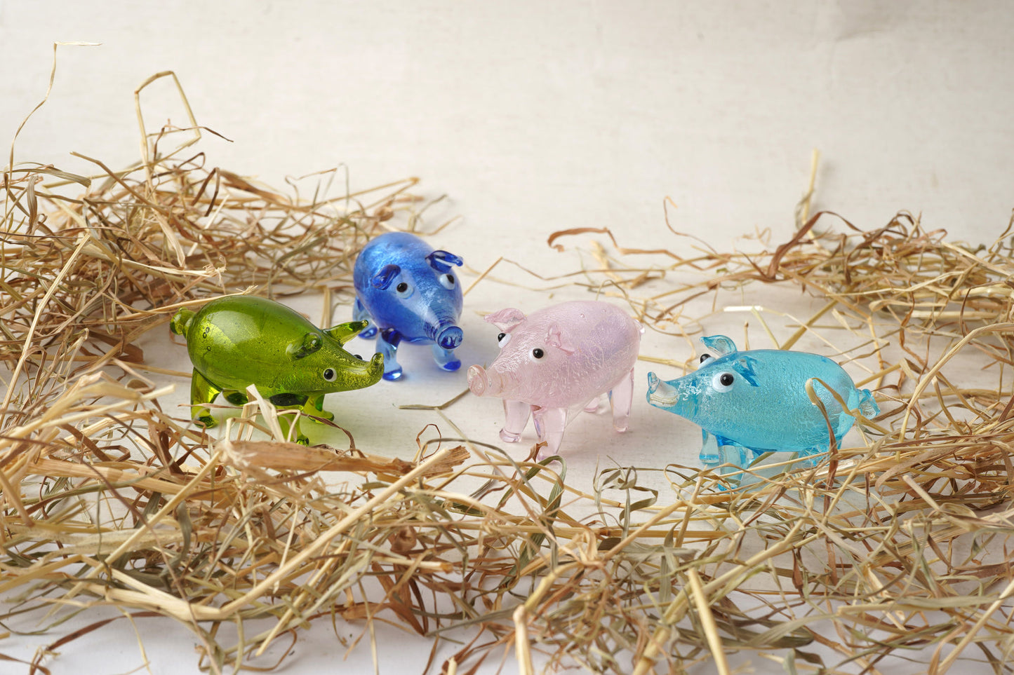 4 Assorted Small Glass Pig