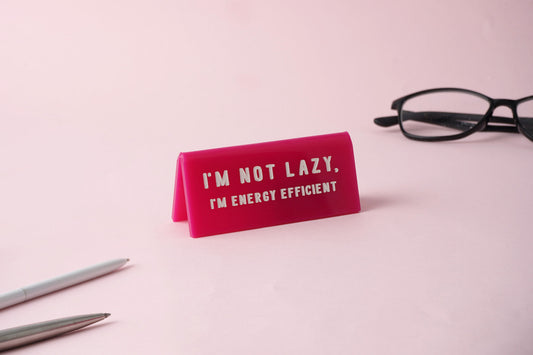 'I'm Not Lazy I'm Energy Efficient' Pink Desk Sign