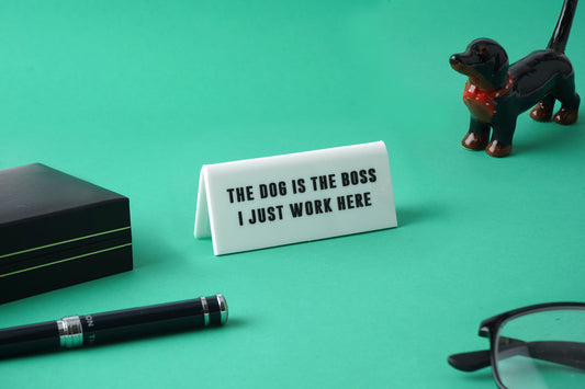 'The Dog Is The Boss I Just...' White Desk Sign