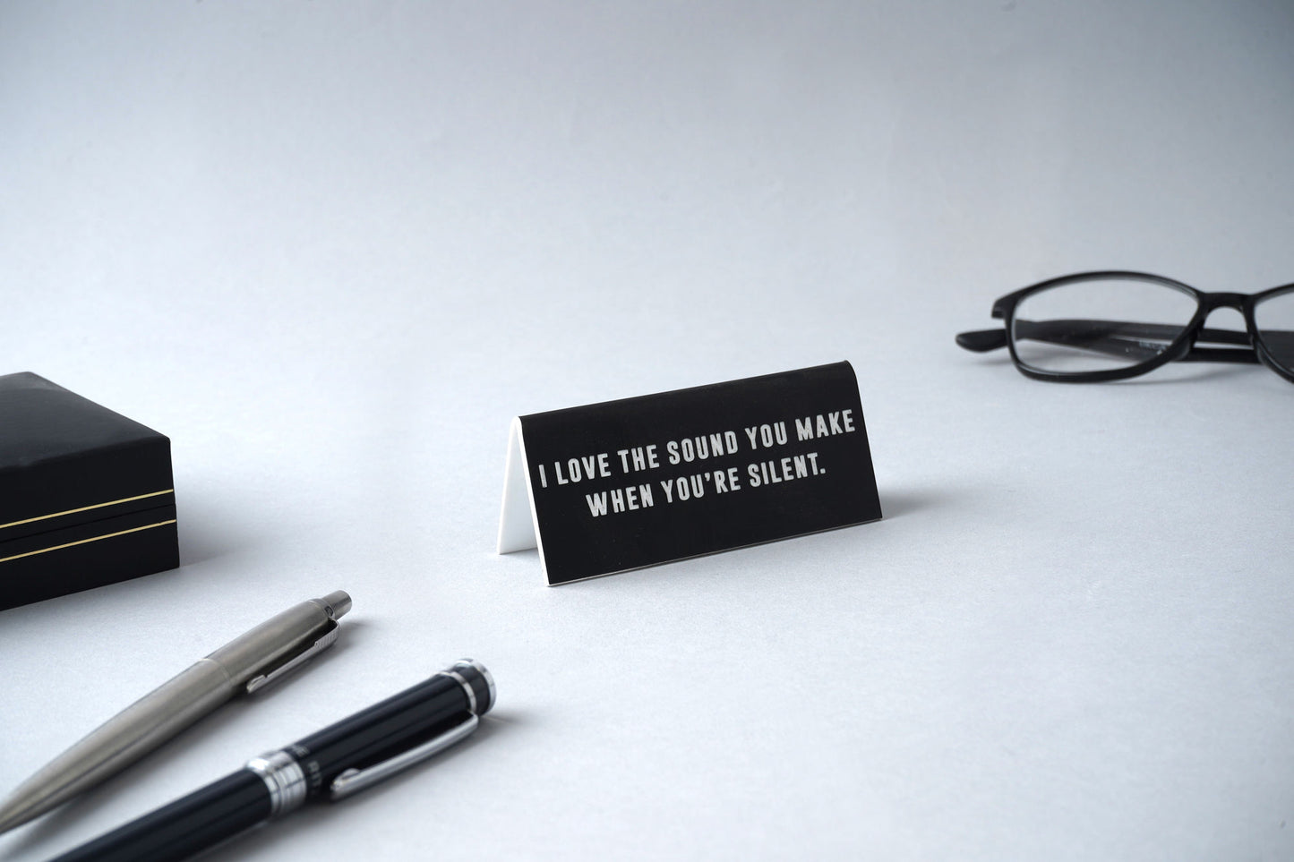 '...You Make When You're Silent. 'Black Desk Sign